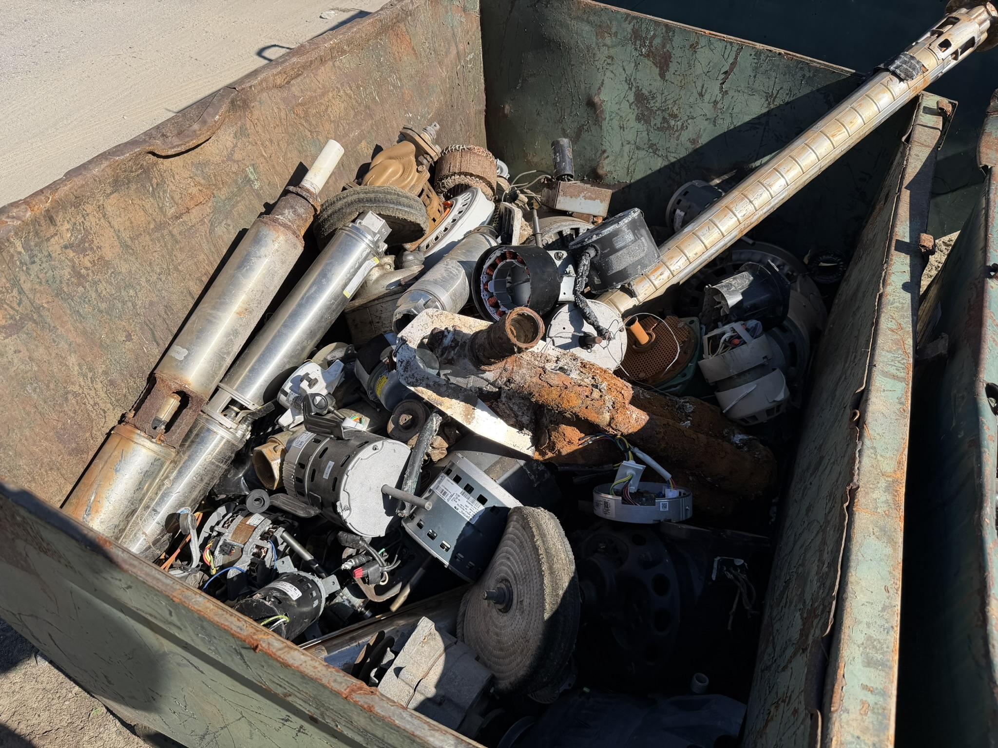 A container part-filled with electric motors, converters and other specialty items